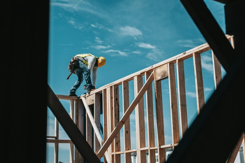 man on wall framing